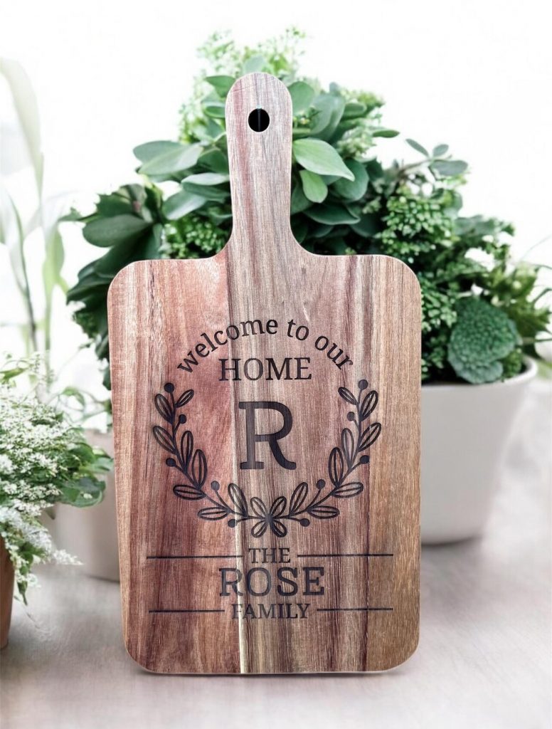 Acacia cutting board with laser engraving customized with name.